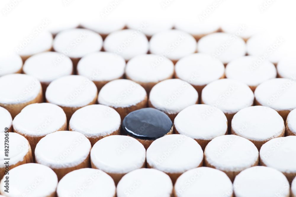 the one black in white of Wooden Revessi Othello game close up of Different wood stick , Business concept, Selective focus the one black in white of Wooden Revessi Othello game close up of Different wood stick , Business concept, Selective focus