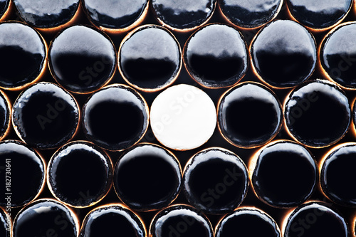 the one white in black of  Wooden Revessi Othello game close up of Different wood stick , Business concept, Selective focus