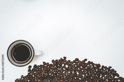 Fototapeta Naklejka Na Ścianę i Meble -  Cup of coffee and coffee beans isolated on white background