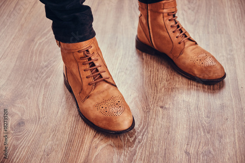Brown leather woman boots.