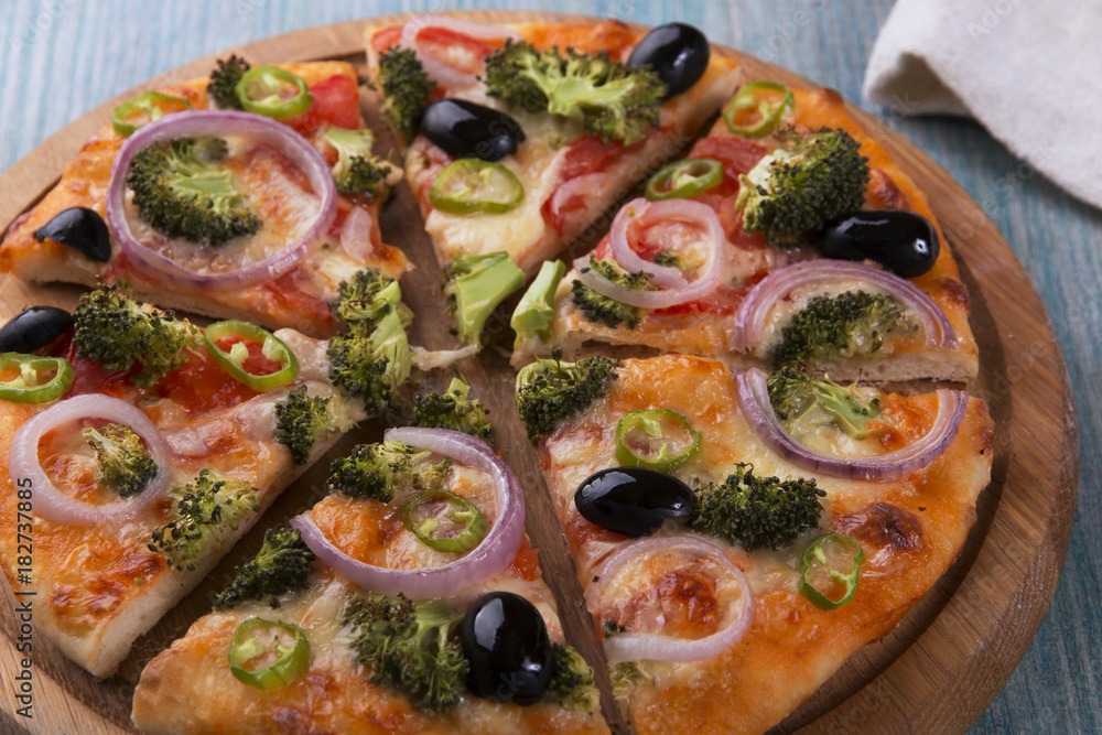 Vegetarian pizza with broccoli tomato cheese Vegetarian pizza with broccoli tomato cheese