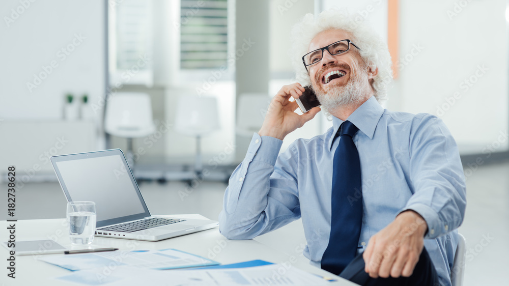 Happy businessman on the phone Happy businessman on the phone