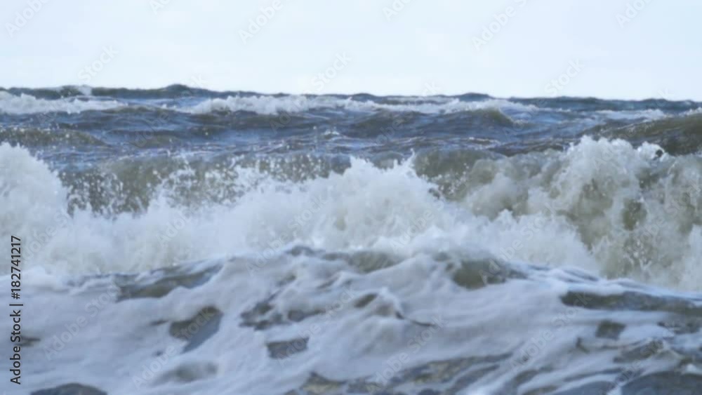 Stormy seas during bad weather cyclone hurricane Winds. Slow motion sea ocean water big surf wave splash beach. Stormy seas during bad weather cyclone hurricane Winds. Slow motion sea ocean water big surf wave splash beach.