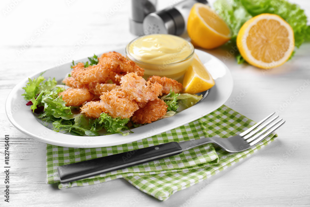Plate with tasty shrimp basket and sauce on table Plate with tasty shrimp basket and sauce on table