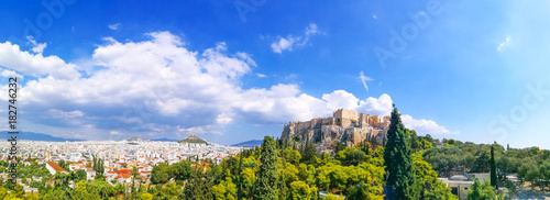 Panorama of Acropolis of Athens. Parthenon construction in Acropolis Hill in Athens, Greece. Beautiful landscape with green trees around ancient architecture. © Artem