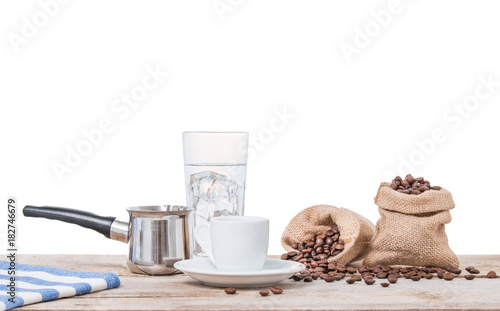 Coffee copper  cup and water. Greek coffee with pot and sacks full of coffee beans. Turkish coffee pot  white cup and pouch with beans. Isolated on white.