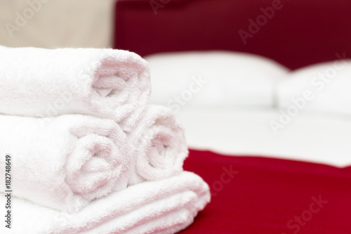 Clean towels on bed at hotel room © fotofabrika