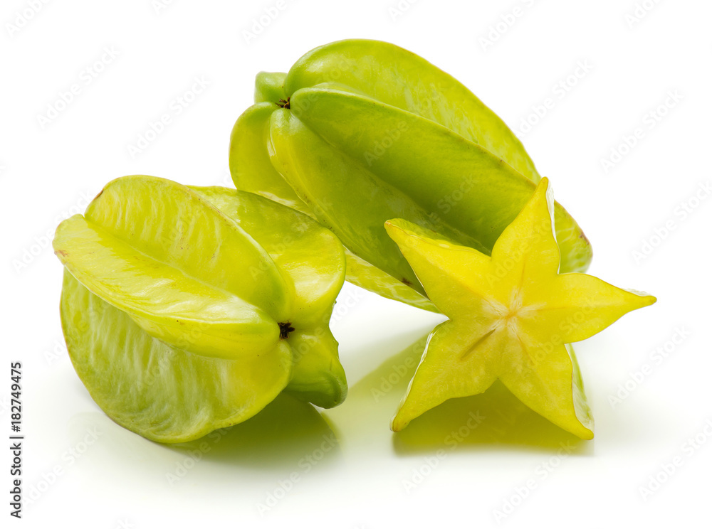 Two carambola and one half isolated on white background. Two carambola and one half isolated on white background.