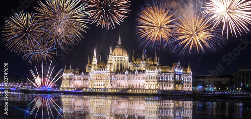 Hungarian parliament at night with fireworks on the black sky , Budapest. Cross Filter Effect