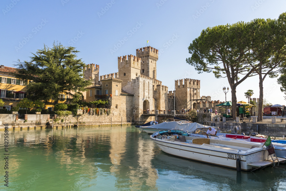 The Castello Scaligero or Scaliger castle, a 13th century medieval port fortification near Lago di Garda in Sirmione, Lombardy, northern Italy