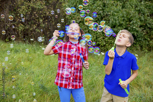 Kids playing with bubbles