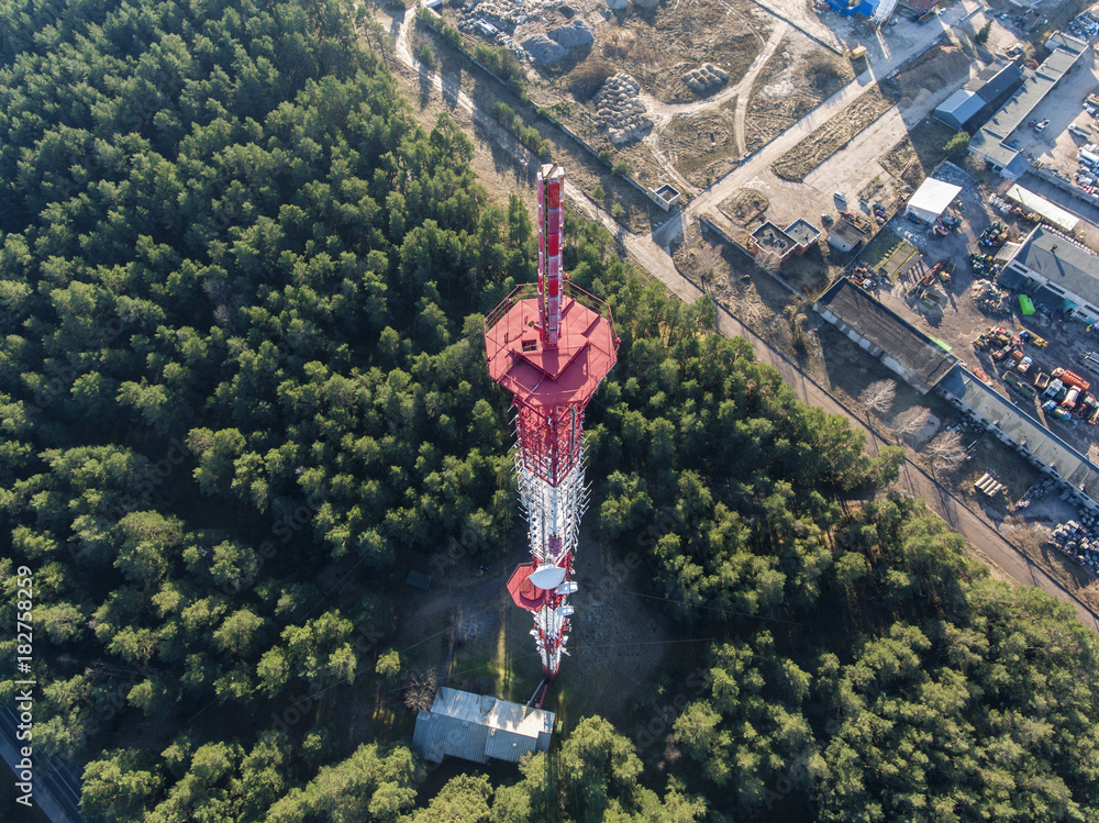 Aerial top down view of a radio tower with industrial site in background.  Stock-Foto | Adobe Stock