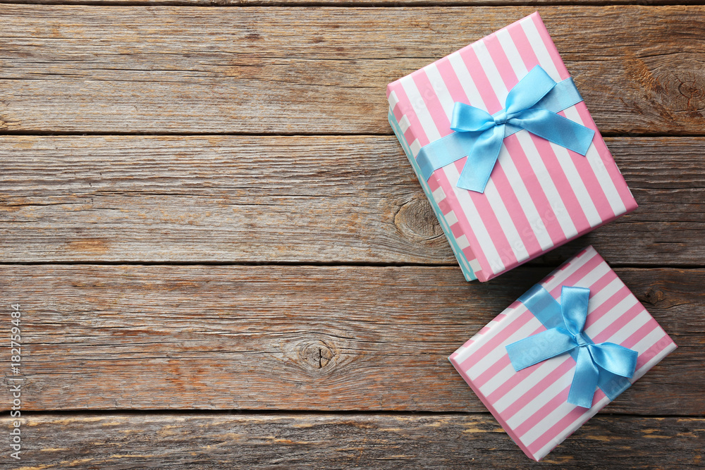 Gift boxes with ribbon on grey wooden table Gift boxes with ribbon on grey wooden table
