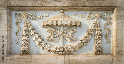 The arms of the Holy See, on the facade of the Basilica of Saint John Lateran in Rome, Italy.