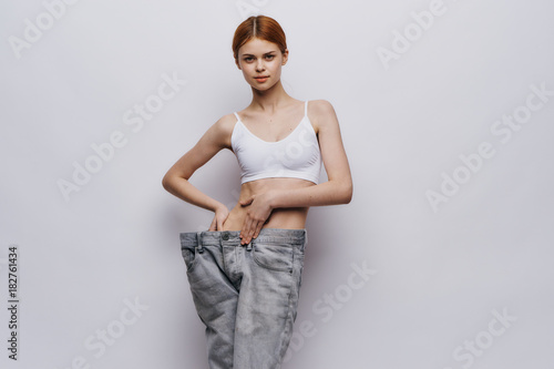 girl shows weight loss © SHOTPRIME STUDIO