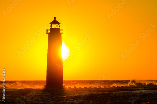 A late November sunset behind the Grand Haven, Michigan, lighthouse and pier