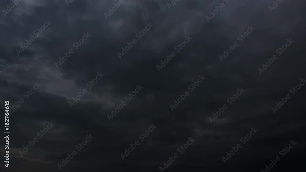 Thunderstorm clouds at night with lightning strikes. 4K Timelapse Loop. Evening lightning strikes video landscape background. Impressive lightning storm sky. Several powerful flashes and lights. Thunderstorm clouds at night with lightning strikes. 4K Timelapse Loop. Evening lightning strikes video landscape background. Impressive lightning storm sky. Several powerful flashes and lights.