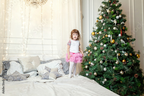 young girl near a Christmas tree © Юлия Завалишина