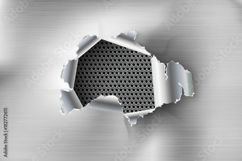Hole torn in ripped steel on metal background