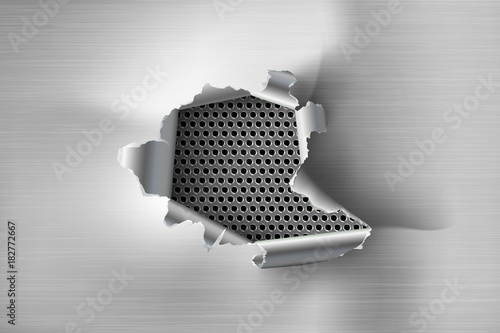 Hole torn in ripped steel on metal background