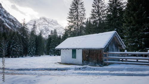 Mountain chalet in snowy alpine valley © DarwelShots