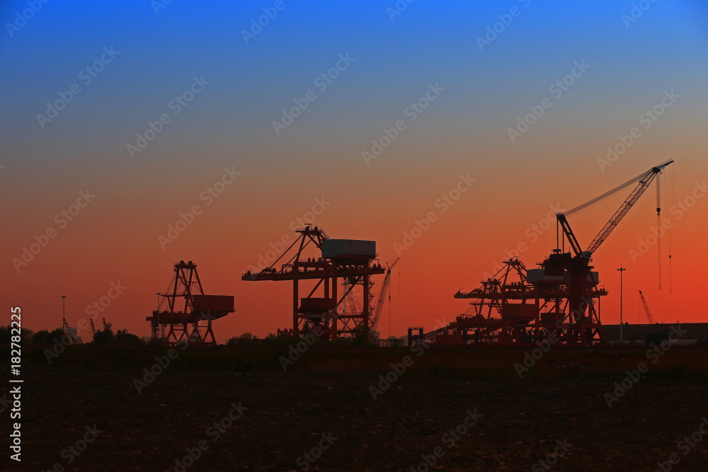 Port crane unloading container ships Port crane unloading container ships