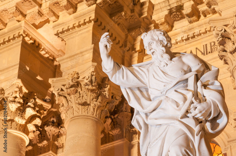Landmarks of Italy: the statue of St. Paul in the facade of the Cathedral in Ortigia, the old part of Syracuse, Sicily