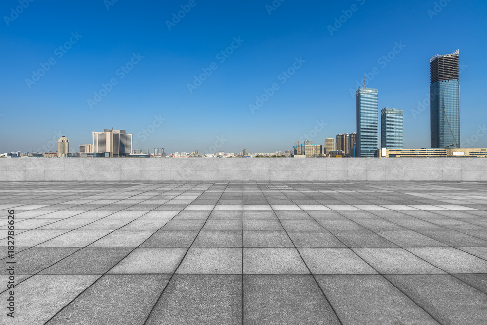 cityscape and skyline in blue sky from empty floor