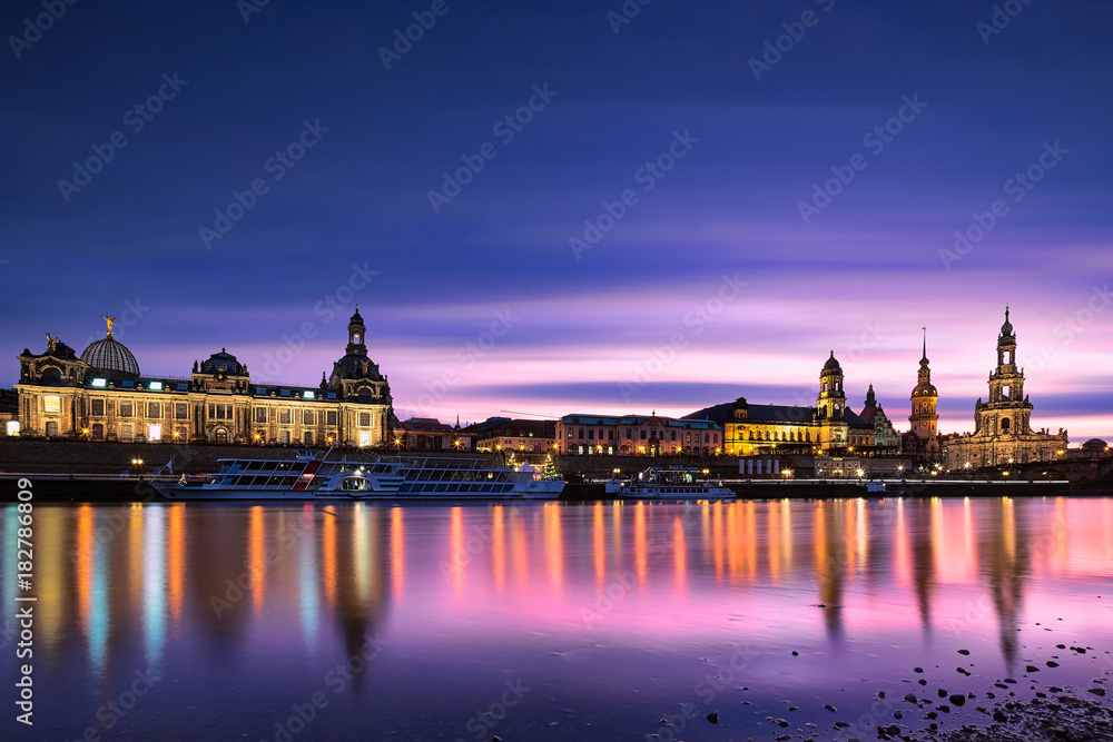 Dresden cityscape panorama at purple Sunset. Fine art ‎long exposure picture of famous city in Europe with city lights and beautiful ‪‎water reflections in Elbe river. Perfect for wall or postcard