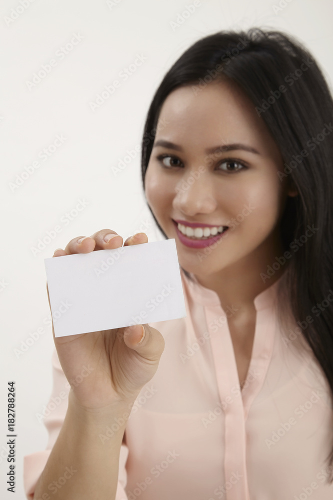 woman holding blank card woman holding blank card