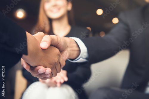 Fotografie, Obraz Businessmen shaking hands after meeting in a cafe