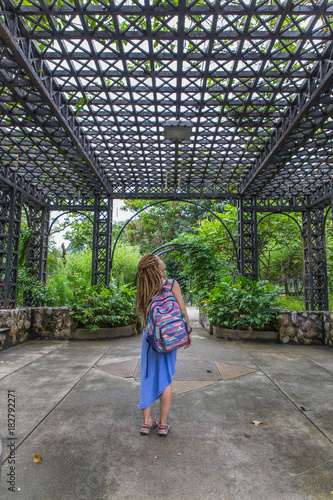backview of girl, staying in the botanical garden of Kuala Lumpur in Malaysia