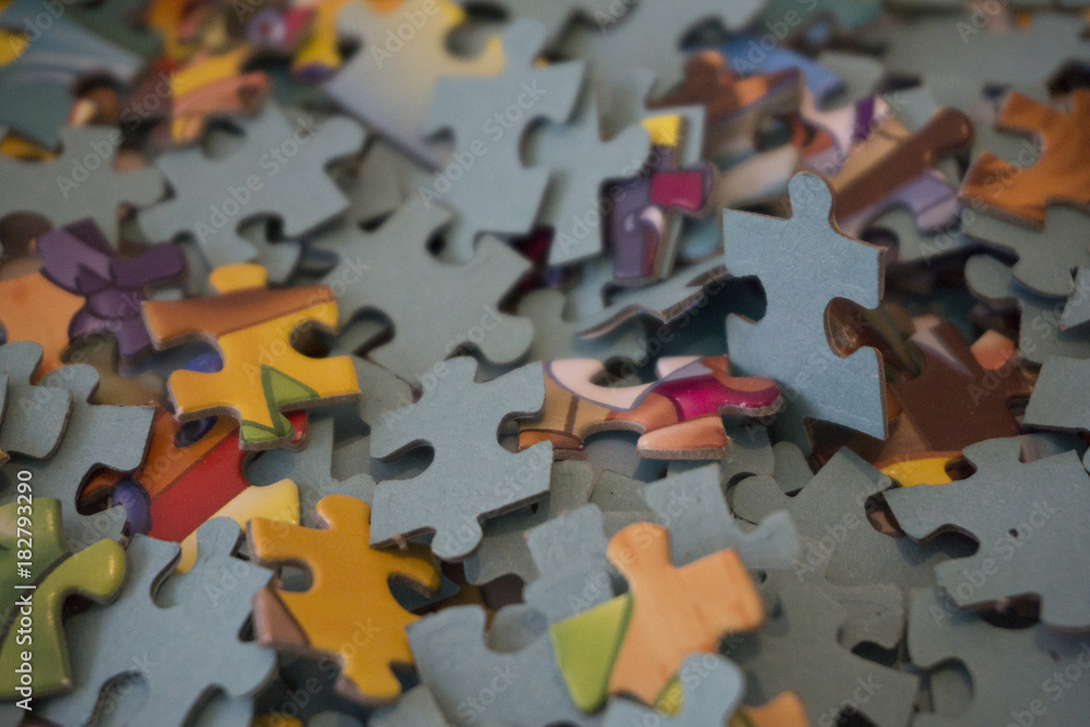 Hand put the last piece of jigsaw puzzle to complete the mission Hand put the last piece of jigsaw puzzle to complete the mission