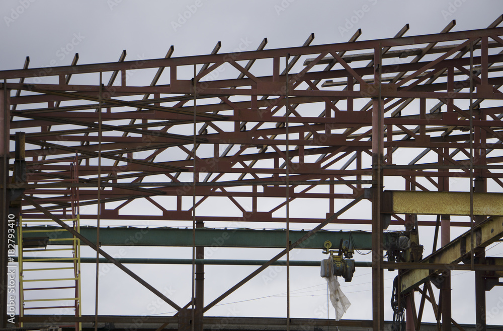 Structure of steel roof frame for building construction on sky background. Structure of steel roof frame for building construction on sky background.