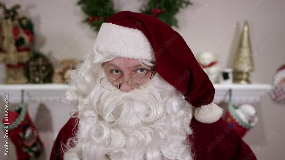 Santa Claus Tilting Glasses on Nose Santa Claus Tilting Glasses on Nose
