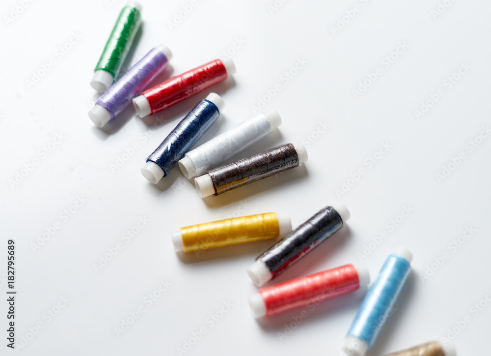 Colorful threads on white background Colorful threads on white background
