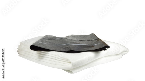 Accessories for watering indoor plants. Capillary mat made of synthetic felt of white color, absorbing and preserving water, and black protective fine-pored film. Isolated on white background