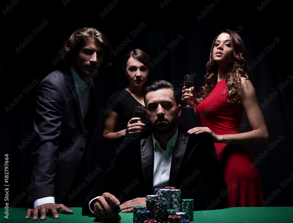Attractive young caucasian man make bet in the casino Attractive young caucasian man make bet in the casino