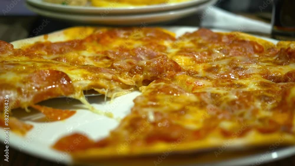 People go pizza in a cafe at a table People go pizza in a cafe at a table