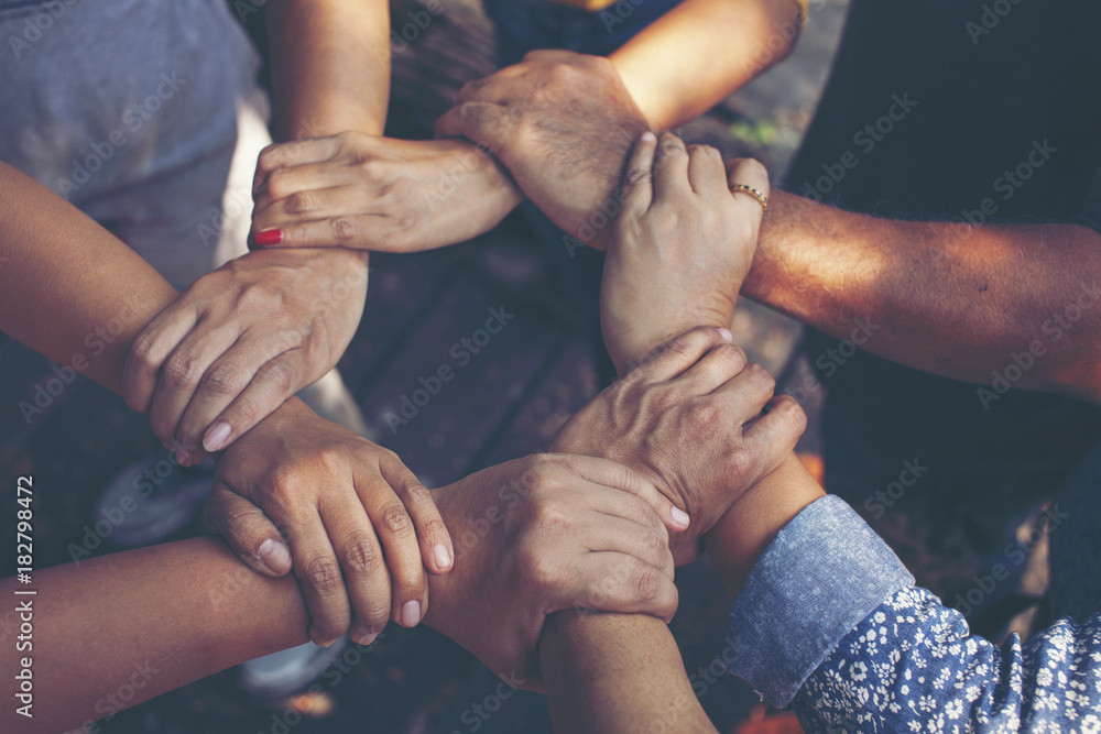 Team Work Concept : Group of Diverse Hands Together Cross Processing of young people in the nature Team Work Concept : Group of Diverse Hands Together Cross Processing of young people in the nature