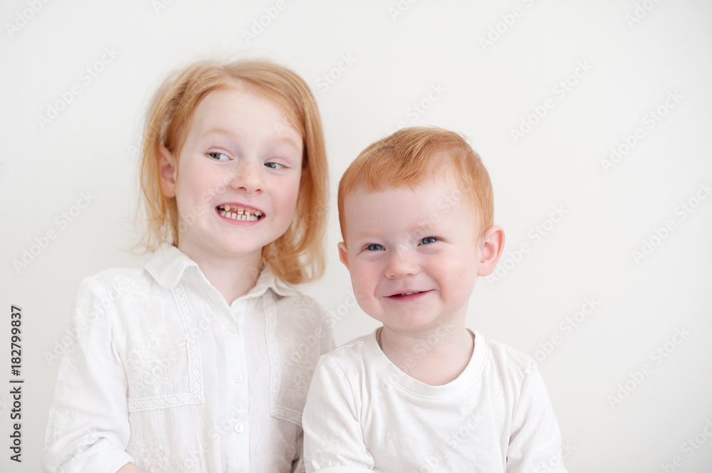 Redheaded funny kids on a white background Redheaded funny kids on a white background
