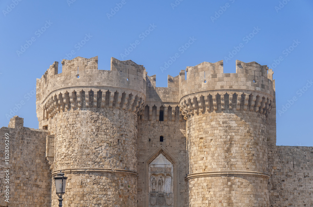 Two tower of Greek castle Rhodes old medieval gate with blue sky