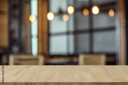 Empty wooden table top with view of room or wooden desk with copy space for your text photo
