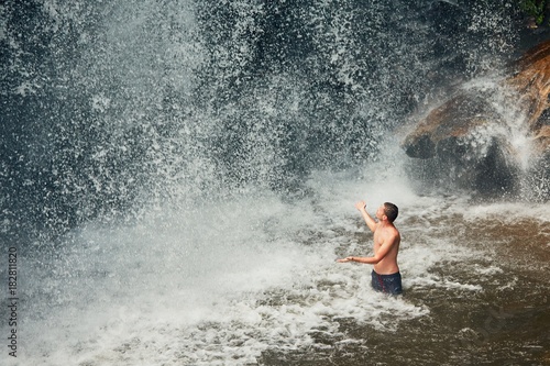 Man in waterfall