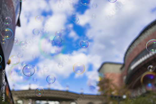 Abstract background   Beautiful bubbles floating on blue sky day.
