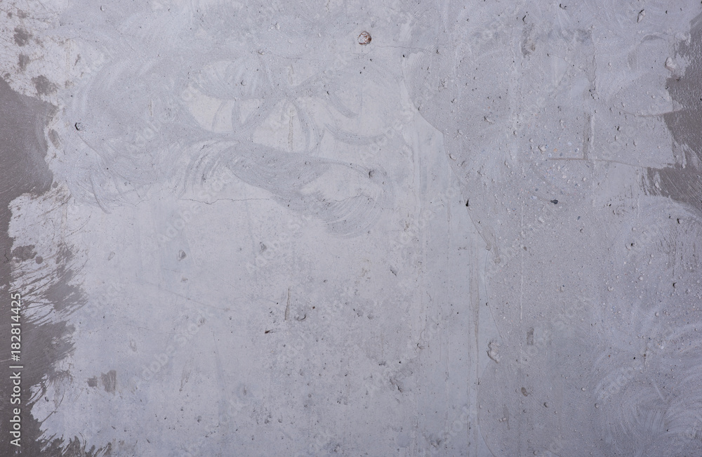 Grungy grey background. Concrete wall with flaws and scratches. Traces of milling