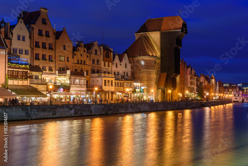 Famous old port crane of Gdansk and Motlawa river at night. Poland, Europe.