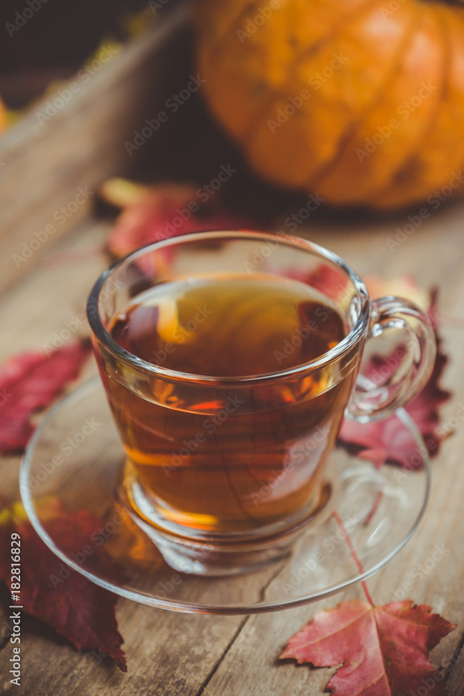 Cup of tea on the rustic background with autumn decoration. Selective focus. Shallow depth of field. Cup of tea on the rustic background with autumn decoration. Selective focus. Shallow depth of field.