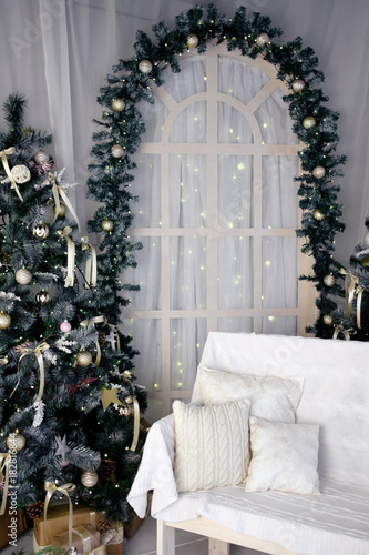 christmas studio decoration with arc, bench and christmas tree