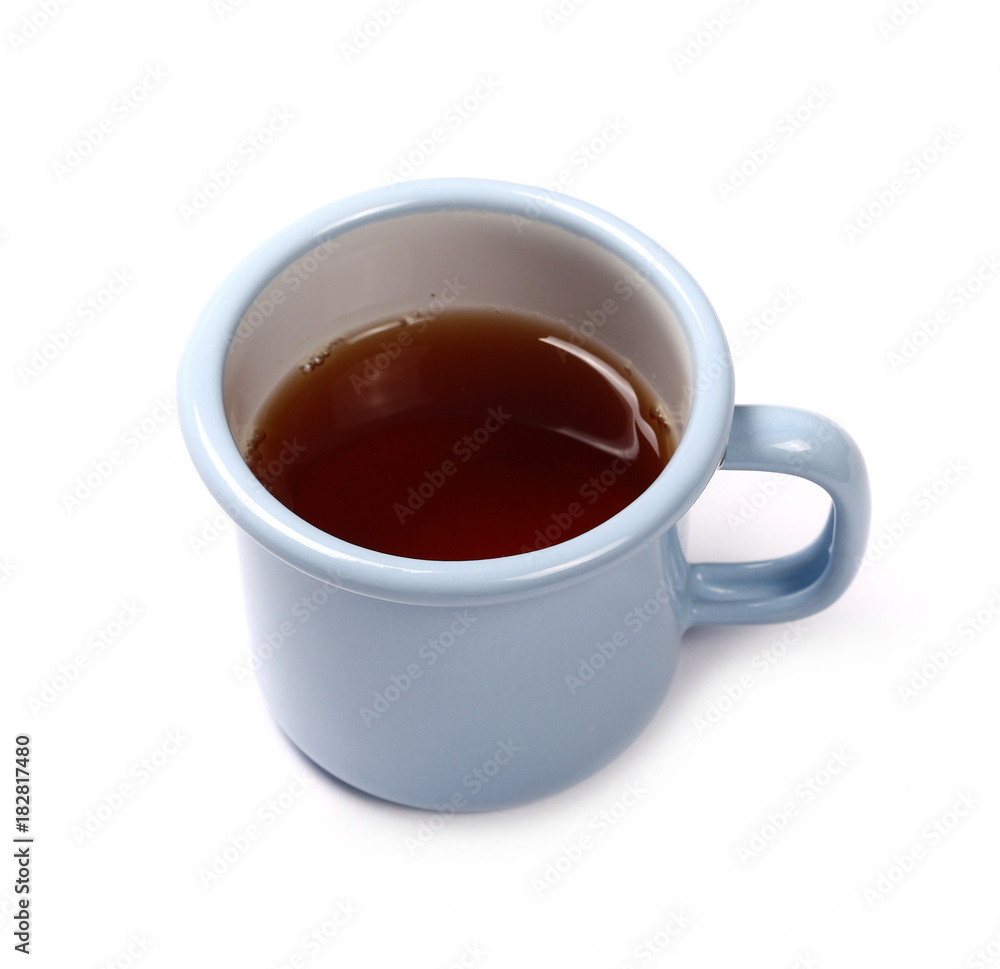 Black tea in blue metal cup isolated on white background Black tea in blue metal cup isolated on white background